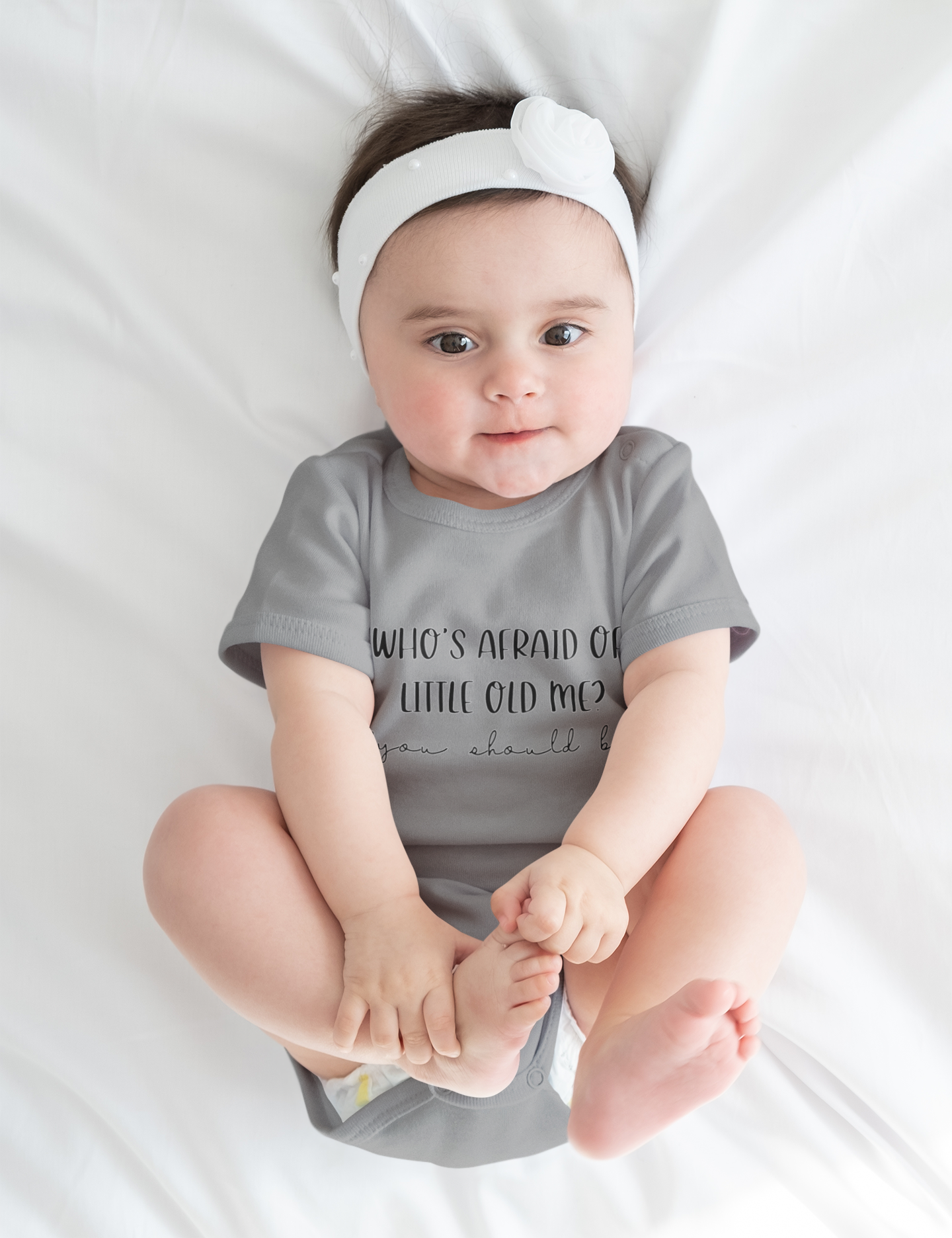 White Taylor Swift Baby Onesie – "Who’s Afraid of Little Old Me?"