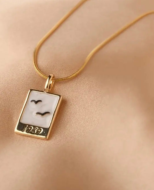 A Stunning 1989 Enamel Charm on A Gold Chain
